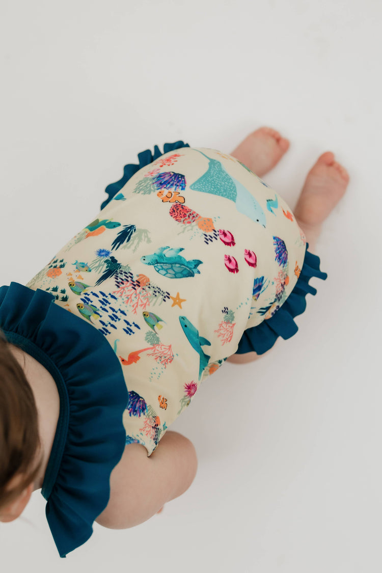 Coral Reef Ruffle Leg One Piece Girls Swimsuit: Blue/Multi / 4/5T